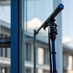 Specialized ladder and reach-and-wash pole equipment used for professional window cleaning, showcasing modern tools.