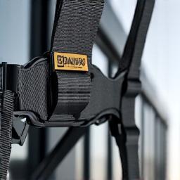 Close-up of a professional window cleaner's safety harness and ropes, emphasizing safety equipment.